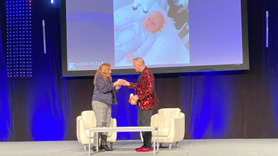 Coffee Chats host Mary Pat Sullivan of Northstar Travel Group accepted a cup of coffee from John Diorio of Virgin Voyages.