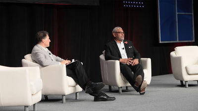 Travel Weekly editor in chief Arnie Weissmann and Carnival Corp. CEO Arnold Donald at CruiseWorld in Miami.