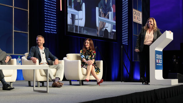 Adolfo Perez of Carnival Cruise Line and Michelle Sutter of Holland America Line on the Masterminds panel; Mary Pat Sullivan of Northstar Travel Group, standing, moderated. Adolfo Perez of Carnival Cruise Line and Michelle Sutter of Holland America Line on the Masterminds panel; Mary Pat Sullivan of Northstar Travel Group, standing, moderated.