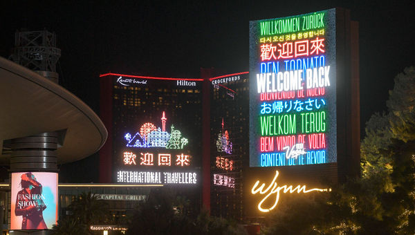 A marquee on the Las Vegas Strip welcomes back international travelers. A marquee on the Las Vegas Strip welcomes back international travelers.