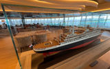 The Rotterdam is the seventh Holland America Line vessel to carry the name, and it features several paintings of previous ships as well as this model of the fifth Rotterdam.