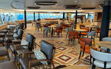 The Rotterdam's Explorations Cafe is the ship's second specialty coffee bar, with panoramic views from the top of the ship.