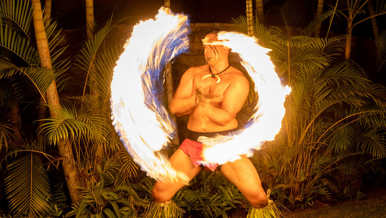 A fire knife performance at the Montage Kapalua Bay's Beach Club Luau. The new luau caps attendance at 40 guests for an intimate, up-close experience.