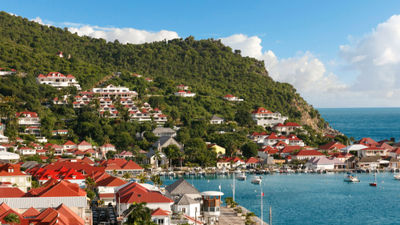 The view from the Hotel Barriere Le Carl Gustaf St. Barth overlooks the island's signature red roofs and the capital of Gustavia.