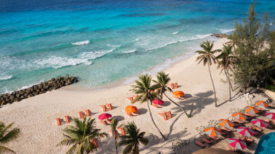 Design elements at the O2 Beach Club and Spa include the bright, pink and orange umbrellas that offer shade on chaise lounges on the wide, long beach.