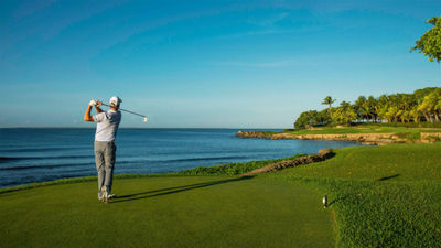 A golfer tees off at the Teeth of the Dog course at Casa de Campo. The resort is offering guests a new insurance plan in light of Covid-19.