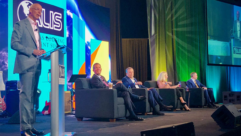 Kevin Mallory, CBRE Hotels' global head and senior managing director, moderates a panel discussion with hotel executives during the opening session of the Americas Lodging Investment Summit.