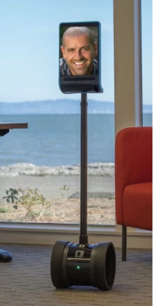 The J.MAK 1000 robot is self-driving and enables Jon Makhmaltchi to attend industry events from home. He can see attendees, and he, in turn, can be seen on its screen. The J.MAK 1000 robot is self-driving and enables Jon Makhmaltchi to attend industry events from home. He can see attendees, and he, in turn, can be seen on its screen.