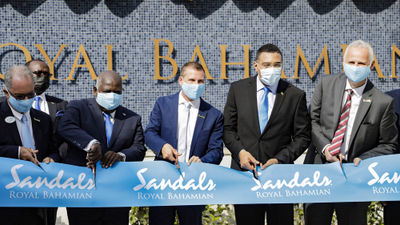 Joining Sandals executive chairman Adam Stewart, second from right, at the ribbon-cutting ceremony at the Sandals Royal Bahamian Resort were GM Adrian Whitehead; tourism minister I. Chester Cooper; prime minister Philip Davis; Jamaica prime minister Andrew Holness; and Sandals Resorts CEO Gebhard Rainer.