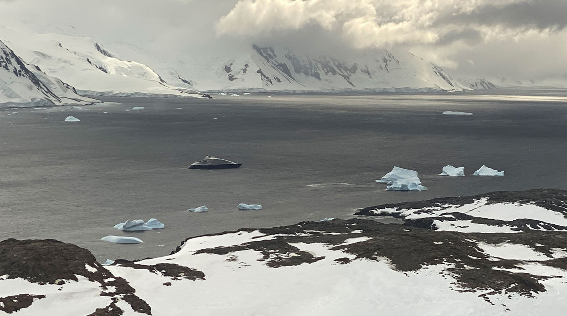 Viewed from a helicopter, the Scenic Eclipse cruise ship looks small against Antarctica's grandeur.