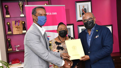 The Jamaica Tourist Board is sponsoring the Jamaican bobsled team, who are now competing at the Winter Olympics in Beijing. Holding the sponsorship announcement is, from left, Chris Stokes, president of the Jamaica Bobsleigh Federation; Olivia Grange, minister of culture, gender, entertainment and sport, and Edmund Bartlett, minister of tourism.