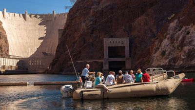 A rafting group enjoys the scenery on the Colorado River below the Hoover Dam.