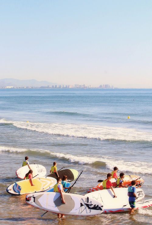 Paddleboarders in Valencia, which has 75 miles of beaches.