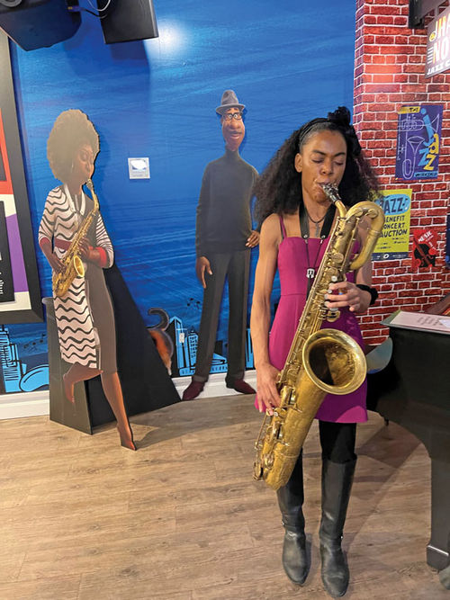 Courtney Wright and her baritone saxophone. Courtney Wright and her baritone saxophone.