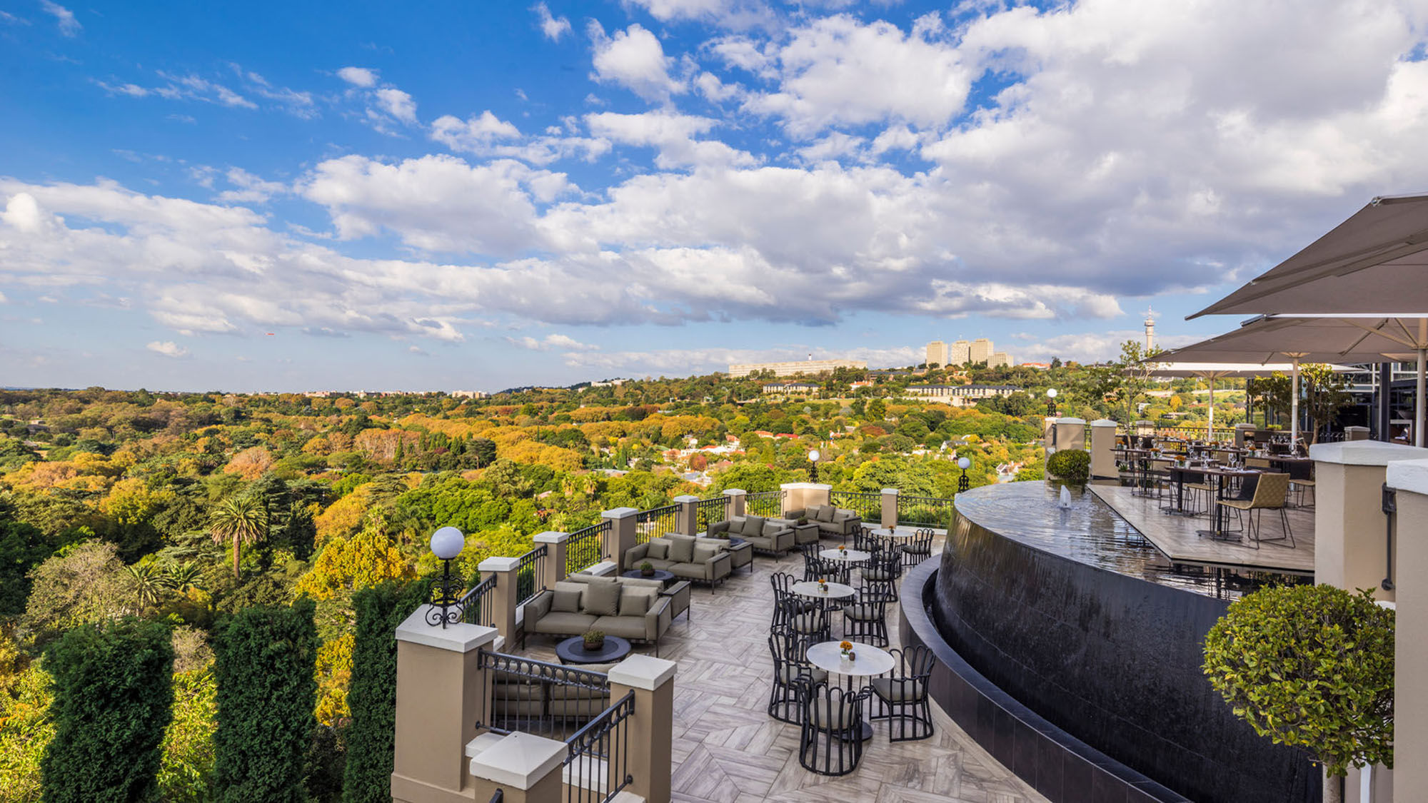 The outdoor dining area at the Four Seasons Hotel, the Westcliff overlooks Johannesburg.