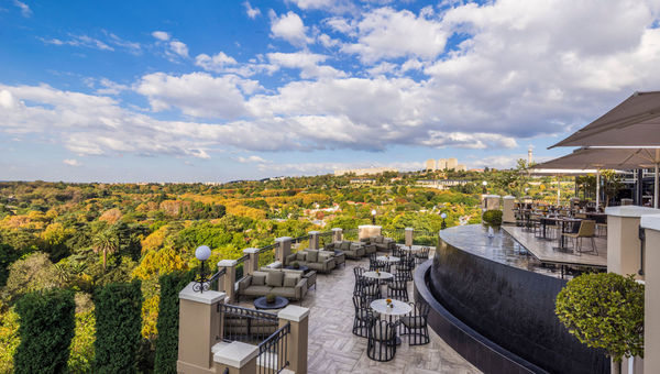 The outdoor dining area at the Four Seasons Hotel, the Westcliff overlooks Johannesburg.
