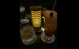 The Nysillin and Bubbles (left), a take on a gin and tonic, and the Mark of the Huntress, a bourbon-forward cocktail (note the speared cherry atop the dehydrated pineapple, as the huntress always hits her mark).