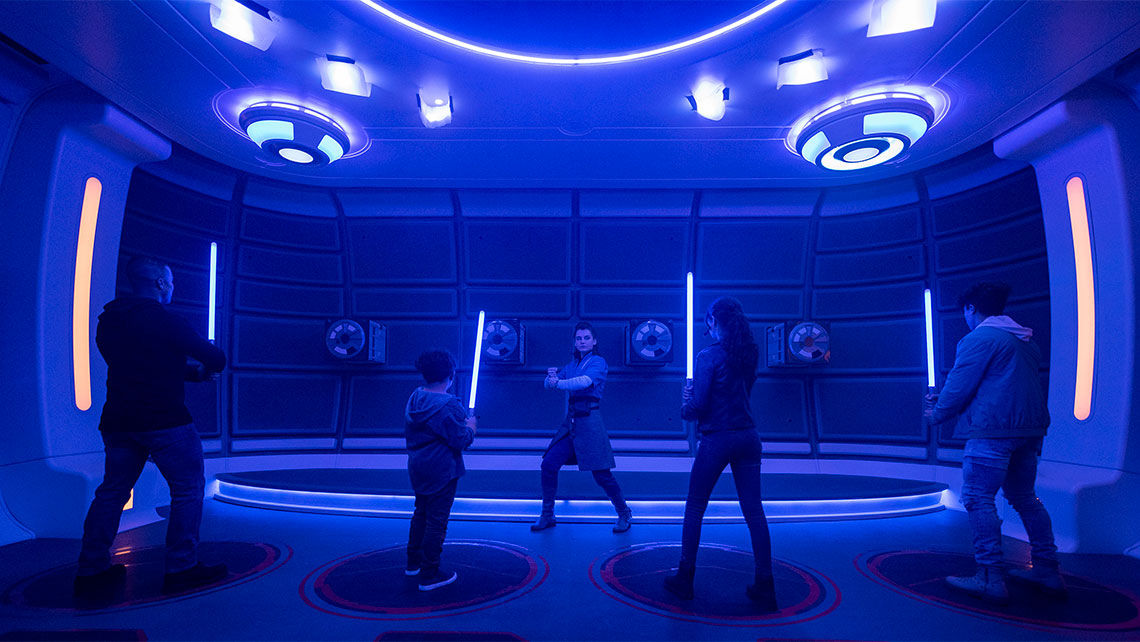 Lightsaber training brings groups of passengers together to learn how to wield the weapon.