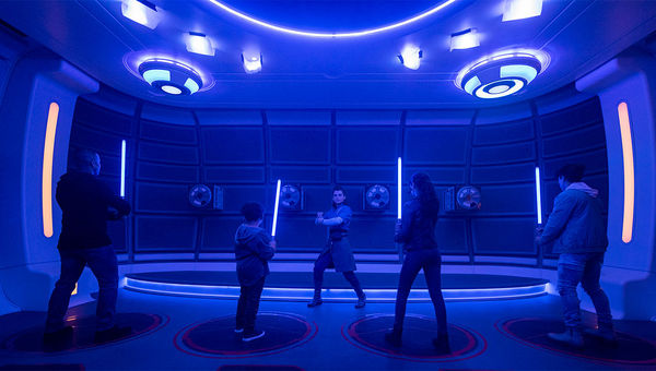 Lightsaber training brings groups of passengers together to learn how to wield the weapon.