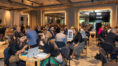 Attendees networking at Proud Experiences in 2019.