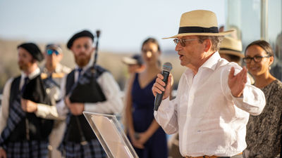 Silversea president and CEO Roberto Martinoli speaks at the christening ceremony for the Silver Origin. Godmother Johanna Carrion stands behind him, at the far right.