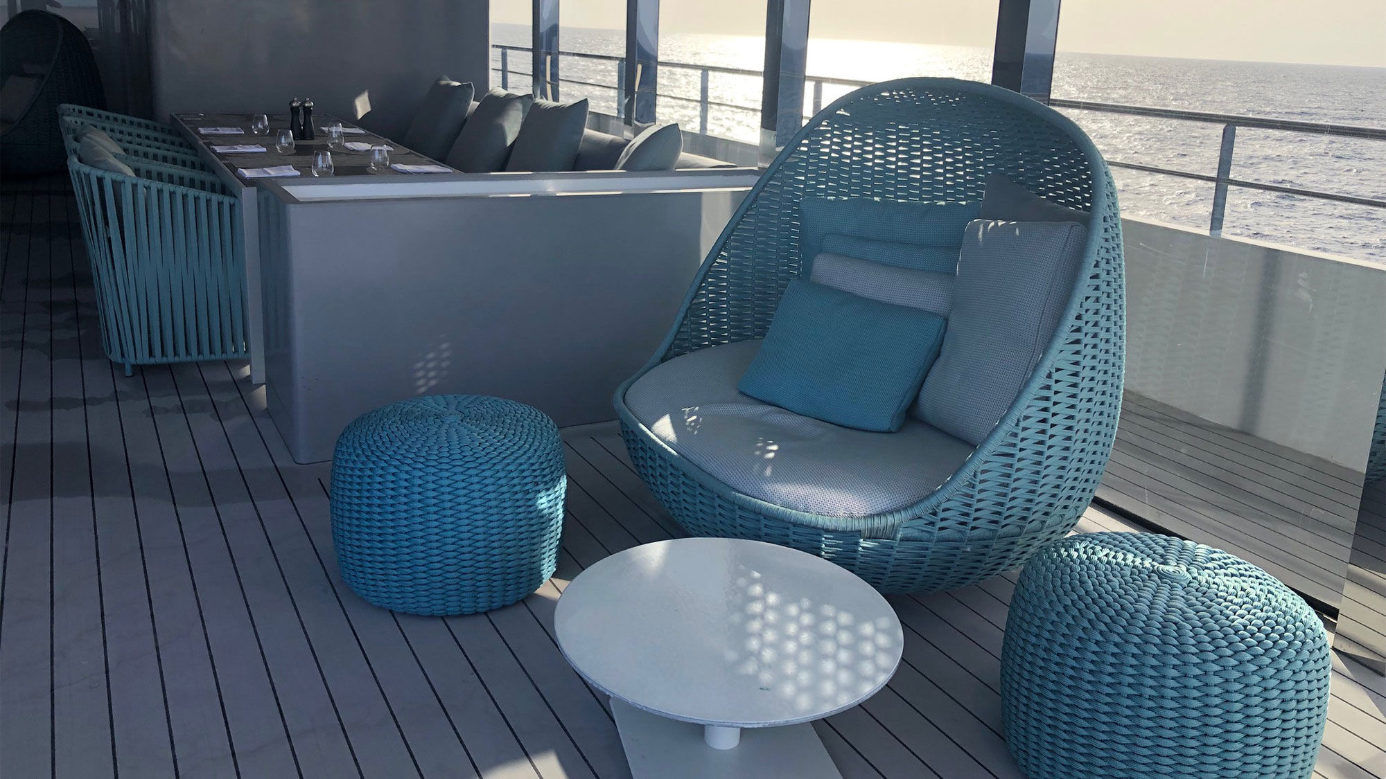 The green chairs and loungers in the Aqua Lounge are among the few pieces of furniture that arrived in time for the first sailing of Emerald Azzurra.