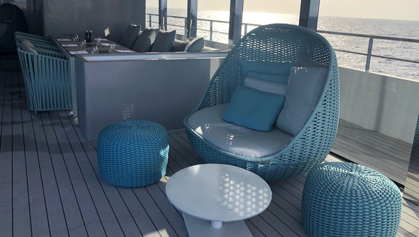 The green chairs and loungers in the Aqua Lounge are among the few pieces of furniture that arrived in time for the first sailing of Emerald Azzurra.