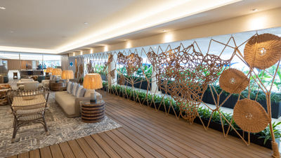 The updated Herb Kane Lounge at the Outrigger Reef Waikiki Beach Resort features a piece by fiber artist Marques Hanalei Marzan that stretches across the space.