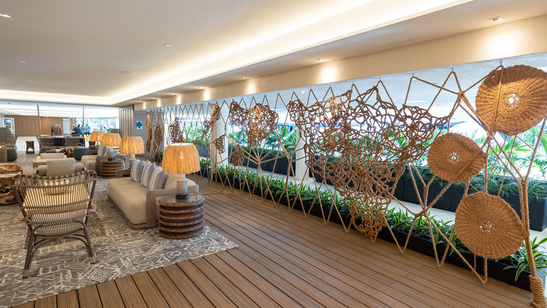 The updated Herb Kane Lounge at the Outrigger Reef Waikiki Beach Resort features a piece by fiber artist Marques Hanalei Marzan that stretches across the space.