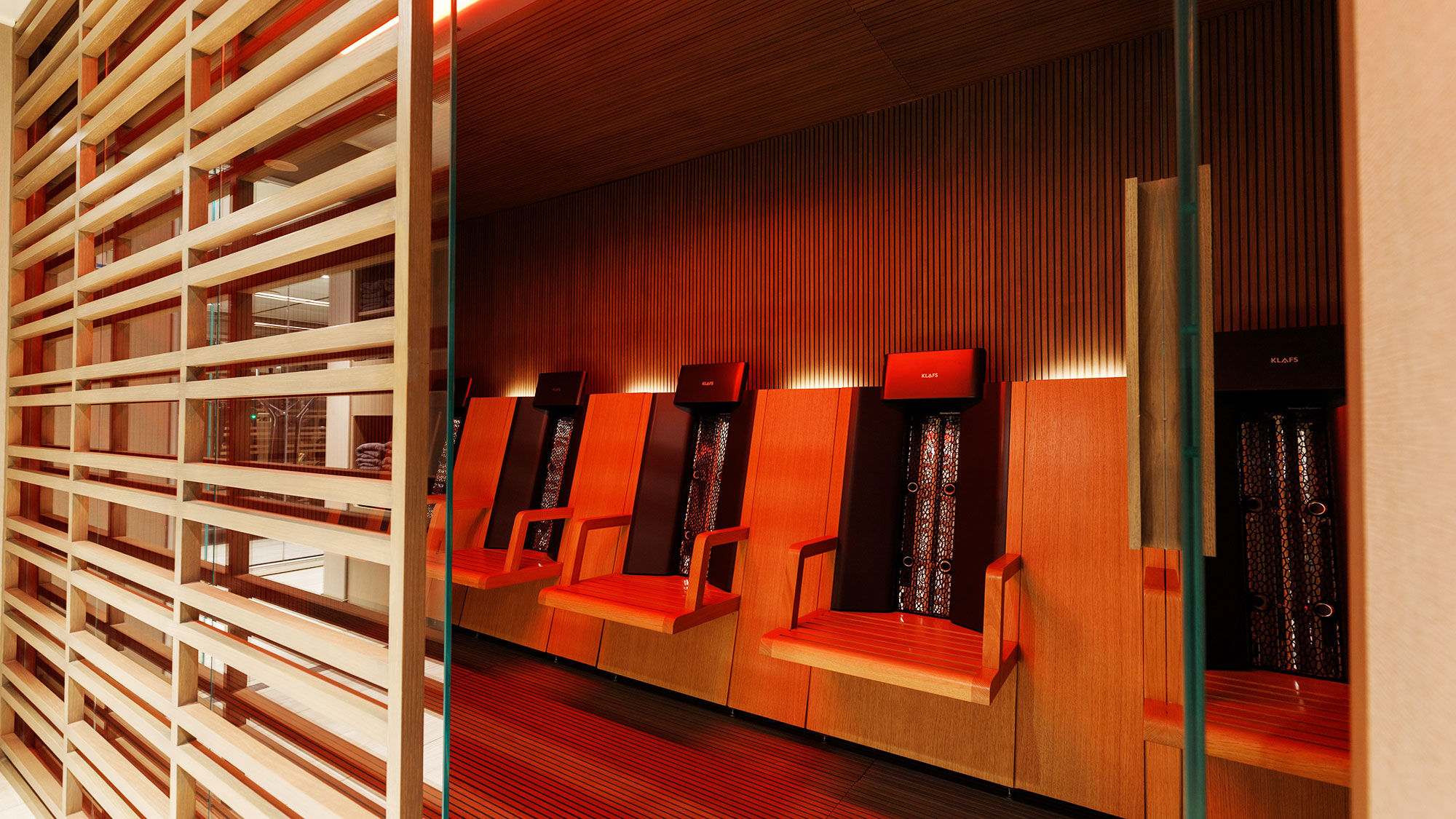 In the spa, seats produce infrared light beams that warm the back, an alternative to a traditional sauna.