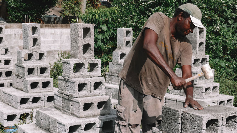 Visitors to Grenada can assist workers in preparing cement blocks to be used as the base of artificial reefs in Grenada's marine protected areas.