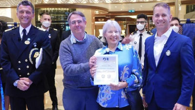 Princess president John Padgett (right) welcomed the Discovery Princess' first guests, loyal customers Michael and Sally Smith.