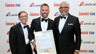 CLIA's Lifetime Achievement Award recipient Adolfo Perez (center) flanked by Carnival chief commercial Officer Ken Tate (left) and Carnival Corp. CEO Arnold Donald.