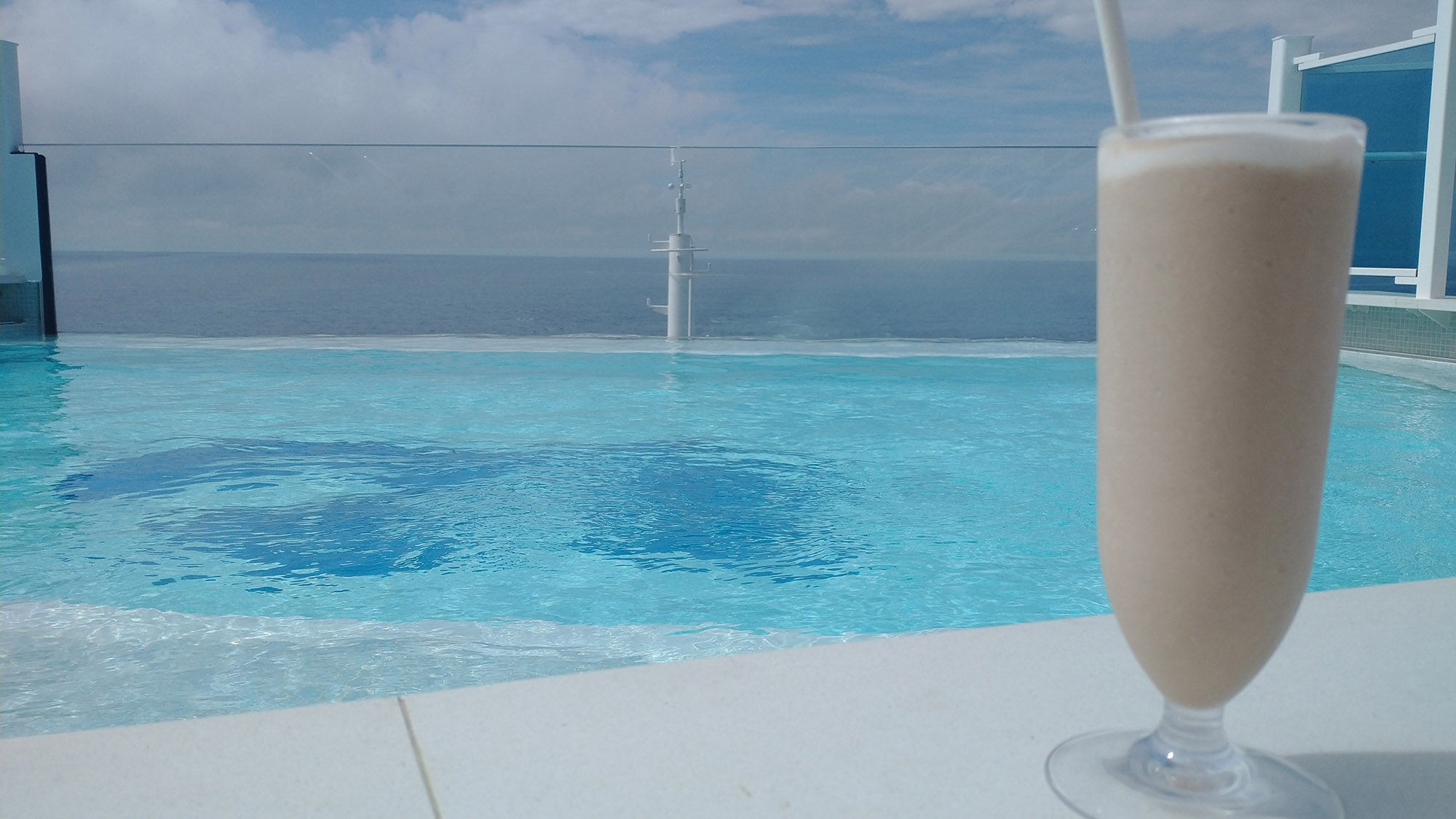 Enjoying a cocktail by the pool.