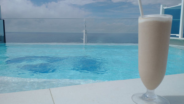 Enjoying a cocktail by the pool.