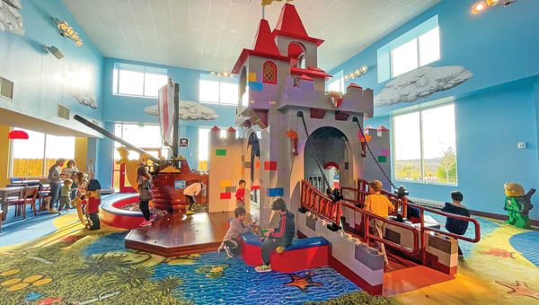 A castle-themed play area in the lobby of Legoland Hotel.