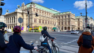 A bike tour through the streets of Vienna on an Active & Discovery excursion takes guests past historical sites like the Vienna Opera House.