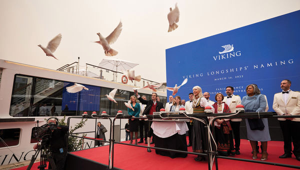 Karine Hagen, in Viking garb, and godmothers from the travel industry welcome new longships to the Viking fleet.