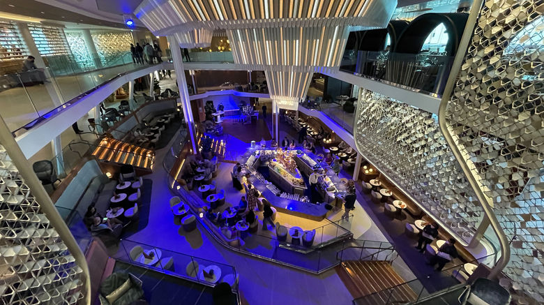 Going Beyond on Celebrity Cruises’ newest Edge-class ship. The Grand Plaza atrium, with the Martinin Bar in the middle, was designed to create the energy of a European piazza.