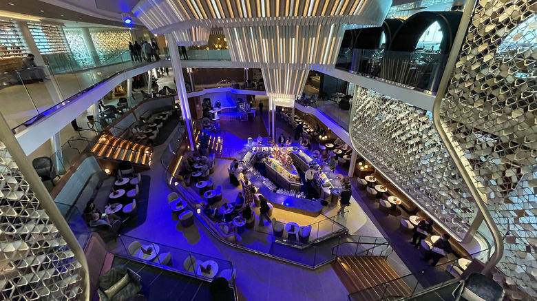 Going Beyond on Celebrity Cruises’ newest Edge-class ship. The Grand Plaza atrium, with the Martini Bar in the middle, was designed to create the energy of a European piazza.