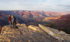 Travelers at the Grand Canyon during a national parks tour.