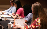 Advisors take notes during GTM West's signature Boardrooms where suppliers present to a small group for 30-minutes at a time.