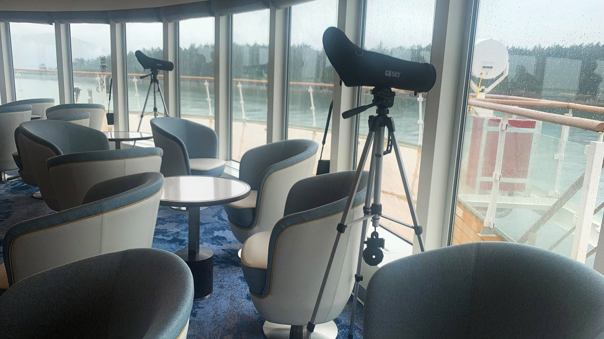 Spotting scopes and binoculars are situated around the Ocean Victory.