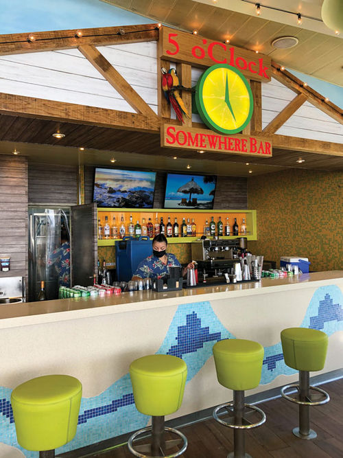 The Margaritaville brand's 5 o'Clock Somewhere Bar on the Paradise is outfitted from top to bottom with plenty of signature theming. The Margaritaville brand's 5 o'Clock Somewhere Bar on the Paradise is outfitted from top to bottom with plenty of signature theming.