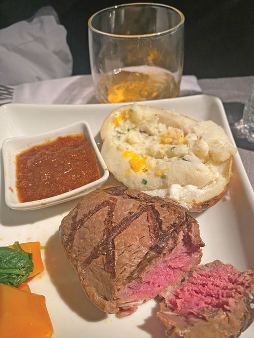 Multi-course meals like this one, which featured a main of beef filet, twice-baked potato, baby spinach and roasted butternut squash, have been resumed in American's longhaul Flagship Business class. Multi-course meals like this one, which featured a main of beef filet, twice-baked potato, baby spinach and roasted butternut squash, have been resumed in American's longhaul Flagship Business class.