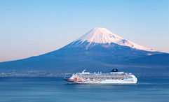 The Norwegian Sun sailing past Mount Fuji in Japan.
