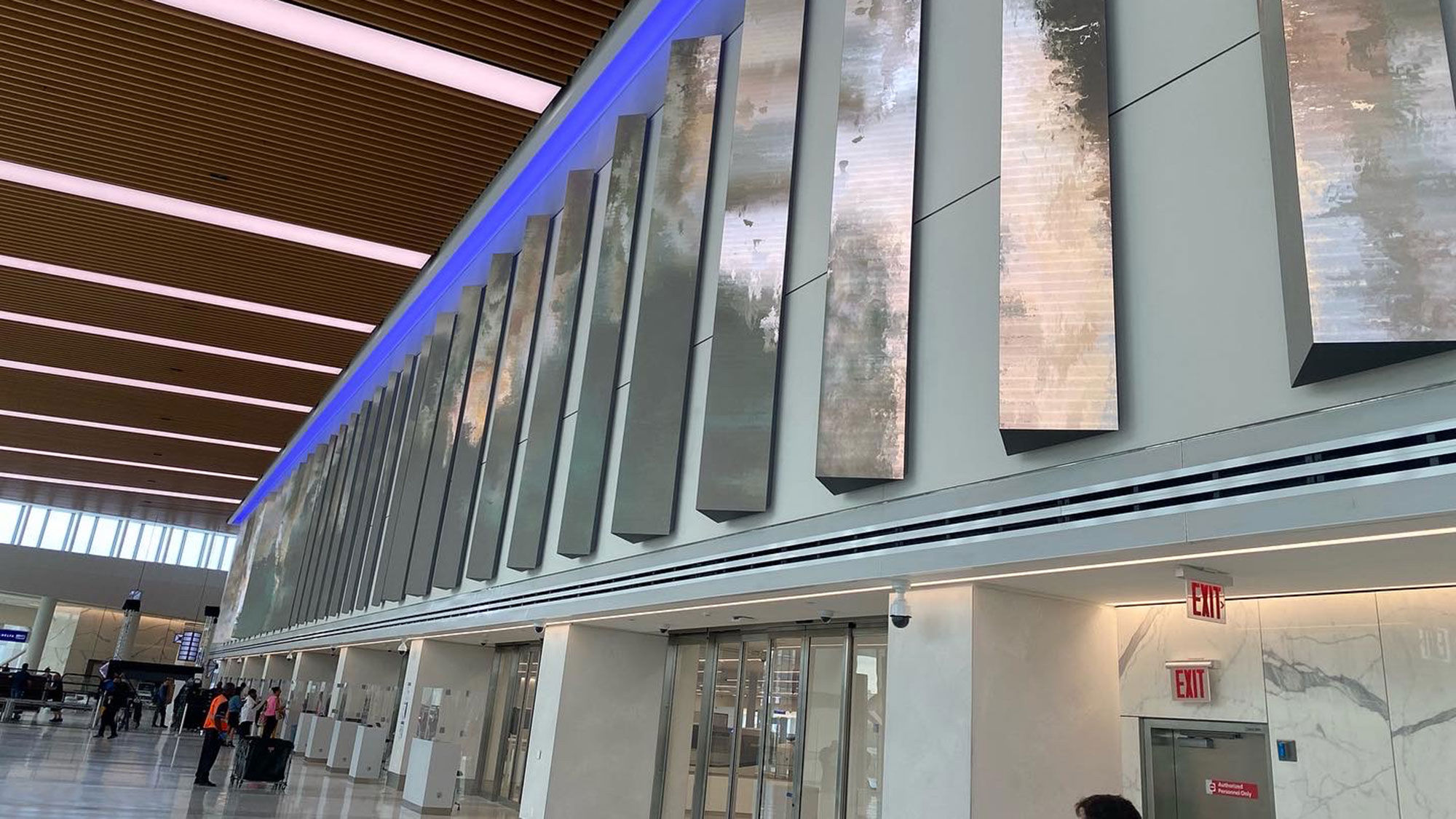 Vertical digital display panels will track flight departures in the TSA security hall.