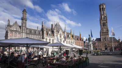 The Belfort, right, looms above the Markt, Bruges' main square.