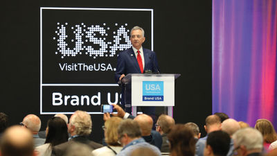 Brand USA CEO Chris Thompson speaking at the IPW conference in Orlando.