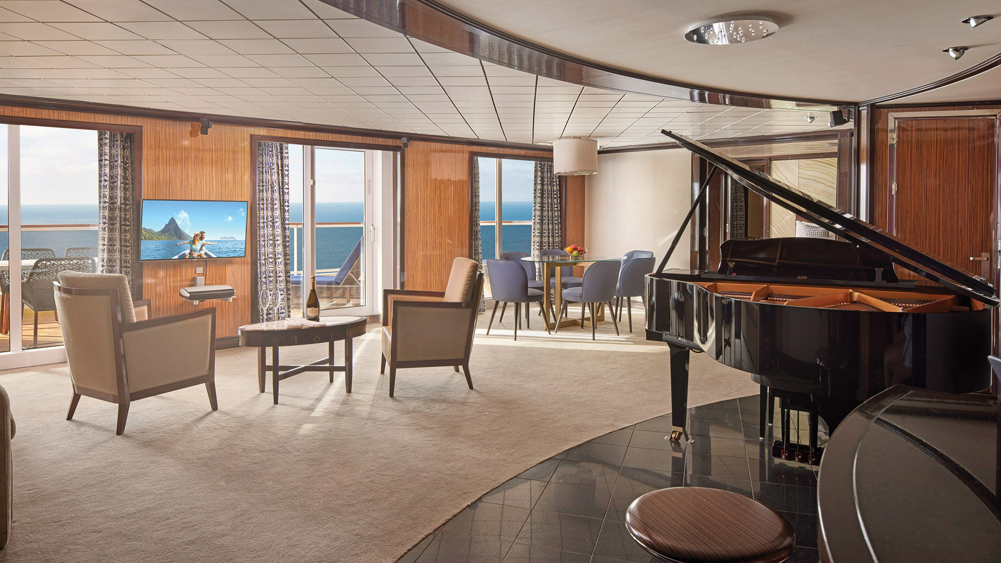 An Owner's Suite with a piano and a large balcony.